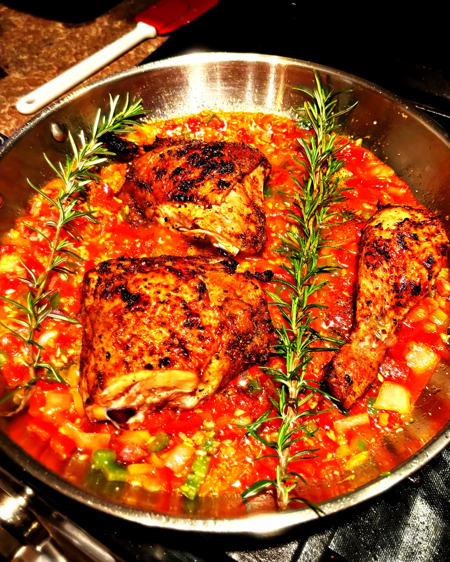 Chicken quarters braised with rosemary and sofrito