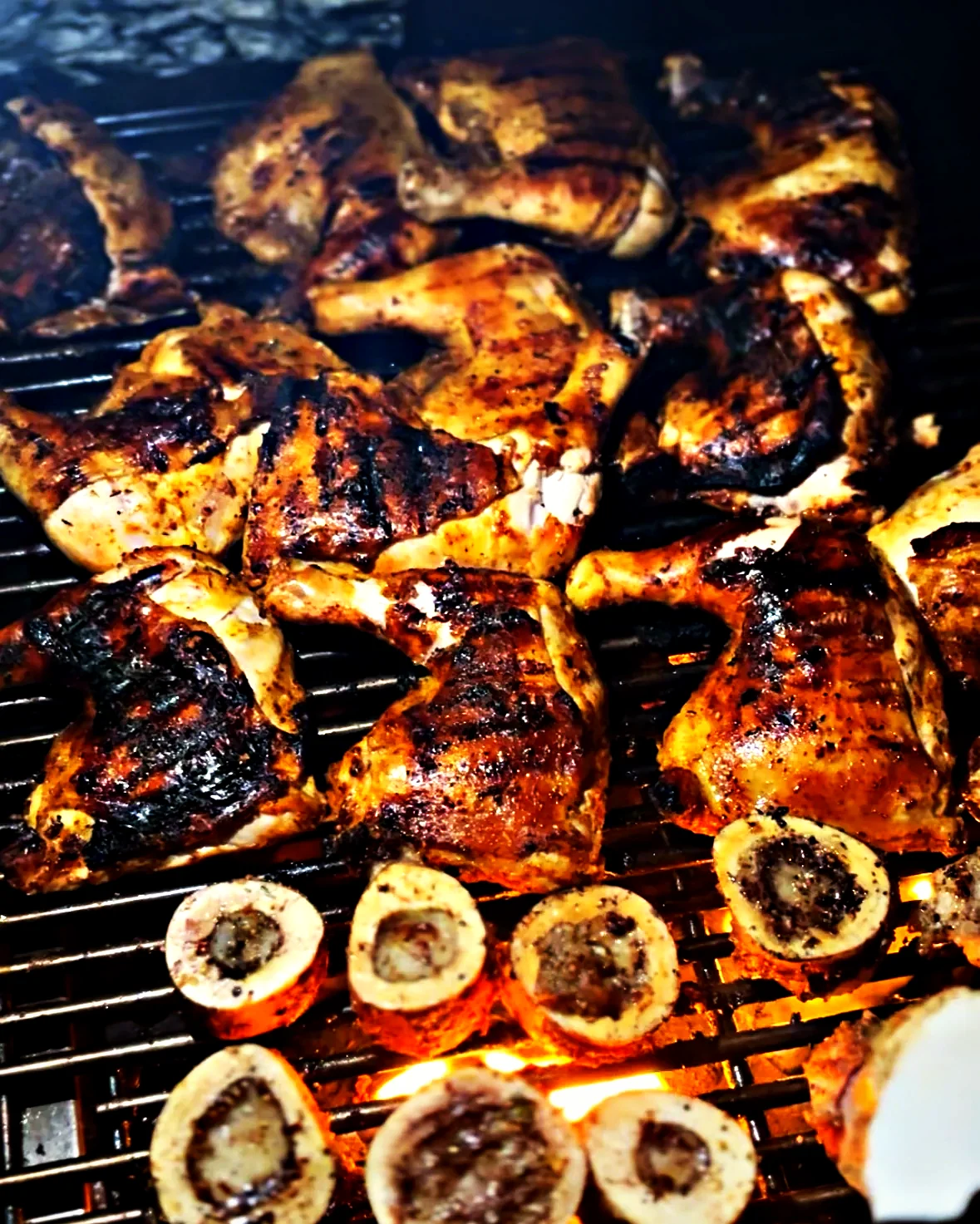 Chicken quarters and bone marrow over open flame