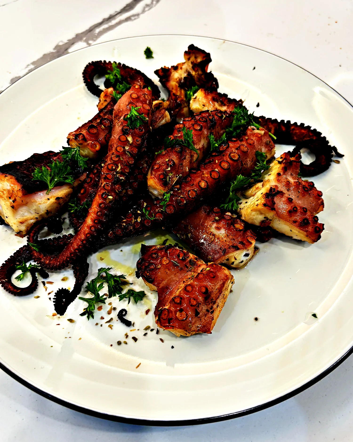 Grilled octopus with parsley and olive oil